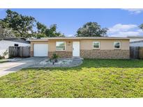Charming single-story home featuring a manicured lawn and a welcoming front entrance at 5632 62Nd N St, St Petersburg, FL 33709