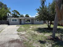 Charming single-story home with a well-maintained yard and mature trees at 2907 W Elrod Ave, Tampa, FL 33611