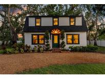 Charming two-story home with a gambrel roof, a welcoming front yard, and stylish curb appeal at 5518 21St S Ave, Gulfport, FL 33707