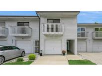 Charming two-story townhome features a private balcony, attached garage, and well-manicured lawn at 6263 93Rd N Ter # 4202, Pinellas Park, FL 33782