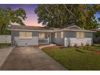 Charming single-story home featuring a welcoming front porch and well-maintained landscaping at 8897 54Th N St, Pinellas Park, FL 33782