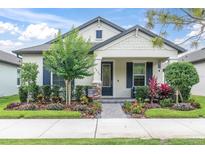 Charming single-story home with well-manicured landscaping and inviting front porch at 3800 Night Star, Odessa, FL 33556