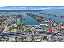 Panoramic aerial view of waterfront complex, showing the surrounding neighborhood and water views at 6161 Gulf Winds Dr # 347, St Pete Beach, FL 33706