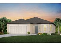 Charming single Gathering home featuring a gray front door, two-car garage and well manicured lawn at 9730 Redwood Heights Loop, Thonotosassa, FL 33592