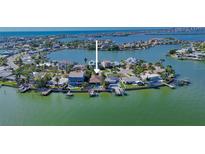 Waterfront home featuring a private dock and a swimming pool at 487 Harbor S Dr, Indian Rocks Beach, FL 33785