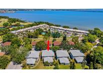 Stunning aerial view of coastal community with manicured lawns near golf course and waterfront at 1813 Bough Ave # B, Clearwater, FL 33760