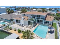 Stunning waterfront home with a private pool and a spacious outdoor deck, perfect for entertaining at 451 Palm Ne Is, Clearwater Beach, FL 33767
