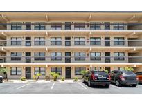 A well-maintained condo building with balconies, parking, and landscaping showing the exterior of this property at 635 30Th W Ave # F309, Bradenton, FL 34205