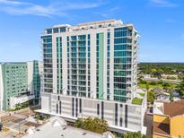 Modern high-rise condominium with glass windows and private balconies offering amazing city views under a clear blue sky at 777 3Rd N Ave # 1406, St Petersburg, FL 33701