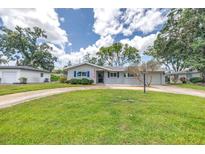 Charming single-story home with a well-manicured lawn, mature trees, and an inviting front entrance at 3652 18Th N Ave, St Petersburg, FL 33713