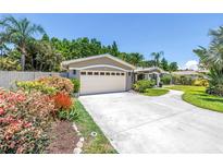 Charming home featuring manicured landscaping, a spacious driveway, and a two-car garage in a desirable neighborhood at 4096 38Th S St, St Petersburg, FL 33711