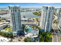 Stunning aerial view of the Towers condominium complex featuring a pool, manicured landscaping, and waterfront views at 449 S 12Th St # 1004, Tampa, FL 33602