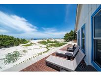 Inviting beachfront deck with lounge chairs offers serene ocean views and direct beach access at 960 Gulf Blvd # 5, Indian Rocks Beach, FL 33785