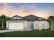Charming single-story home with a two-car garage, complemented by lush landscaping at 9726 Redwood Heights Loop, Thonotosassa, FL 33592
