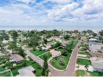 An aerial view showcases the property near the beach with a vibrant neighborhood and clear property lines at 1580 Arizona Ave Ne, St Petersburg, FL 33703