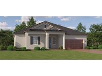 Charming single-Gathering home with a well-manicured lawn and a welcoming facade at 31616 Cardinal Yard Dr, San Antonio, FL 33576