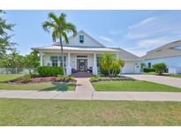 Charming single-Gathering home with a beautifully landscaped front yard and inviting curb appeal at 5710 Tortoise Pl, Apollo Beach, FL 33572