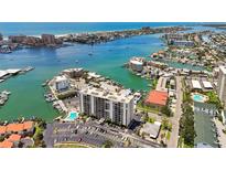 Beautiful waterfront condo complex with pool, boat docks, and stunning coastal views at 255 Dolphin Pt # 207, Clearwater Beach, FL 33767