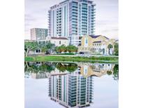 Exterior view of a building complex reflected in the water at 777 3Rd N Ave # 1603, St Petersburg, FL 33701