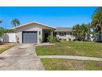 Charming single-story home with a well-manicured front yard and a one-car garage at 529 59Th S Way, St Petersburg, FL 33707