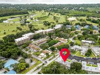 An aerial view of a beautiful community near the water and a golf course at 1250 S Pinellas Ave # 207, Tarpon Springs, FL 34689
