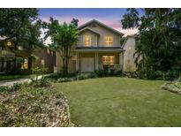 Charming two-story home with a welcoming front porch and well-maintained lawn at 2506 S Obrapia St, Tampa, FL 33629