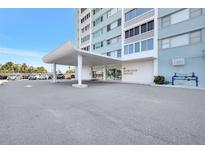 Image of the Horizon House condo building entrance with covered parking at 31 Island Way # 406, Clearwater Beach, FL 33767