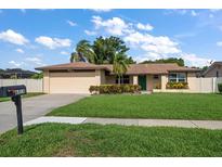 Charming single-story home with well-maintained lawn, mature landscaping, and a cozy, inviting curb appeal at 6530 68Th N St, Pinellas Park, FL 33781