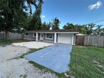 Charming single-story home with well-maintained landscaping and a spacious driveway at 12009 Washington St, Seffner, FL 33584