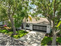 Charming single-story home with a well-maintained lawn, mature trees, and a two-car garage at 2417 Locksley St # 229, Sun City Center, FL 33573