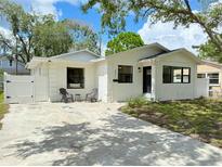 Charming white single-story home with modern windows and a well-manicured front yard at 321 42Nd S Ave, St Petersburg, FL 33705