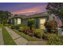 Charming home with a well-manicured lawn and colorful landscaping, showcasing its inviting curb appeal at 6041 Sandhill Ridge Dr, Lithia, FL 33547