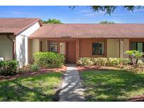 Charming single-story home featuring a landscaped yard and inviting front entrance at 7433 Greystone Dr # 7433, Hudson, FL 34667