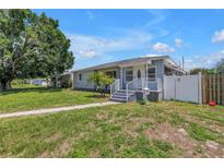 Charming single-story home with a well-manicured lawn and inviting walkway at 774 40Th Ne Ave, St Petersburg, FL 33703