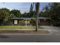 Charming single Gathering home with a well-maintained lawn and cozy curb appeal at 2199 Blue Tern Dr, Palm Harbor, FL 34683