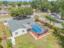Aerial view of a single Gathering home with screened-in pool and fenced yard at 3502 King Richard Ct, Seffner, FL 33584