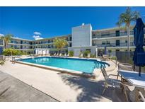 Beautiful pool area with lounge chairs available for relaxation and enjoying the Florida weather at 4050 4Th N St # 116, St Petersburg, FL 33703