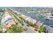 Waterfront home featuring private boat dock, beautiful landscaping and an oversized two-car garage at 835 Symphony Isles Blvd, Apollo Beach, FL 33572