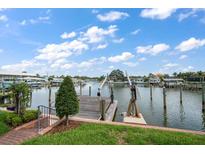 Scenic waterfront dock with boat lift provides direct access to open water and stunning views at 4146 Harbor Hills Dr, Largo, FL 33770