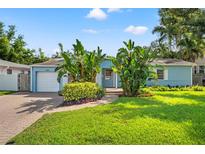 Charming one-story home with a well-manicured lawn and landscaping at 605 Bosphorous Ave, Tampa, FL 33606