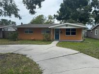 Charming single-story home with a well-maintained lawn and a classic concrete driveway at 217 43Rd Ne Ave, St Petersburg, FL 33703
