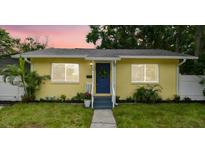 Charming yellow home with a neatly manicured lawn, inviting curb appeal at 508 38Th N Ave, St Petersburg, FL 33704