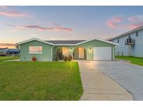 Charming single-story home with a well-maintained lawn and inviting curb appeal at 7401 Islander Ln, Hudson, FL 34667