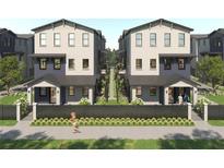 Modern townhome showcasing a neutral palette, welcoming front porches, and manicured landscaping at 3005 1St N Ave, St Petersburg, FL 33713