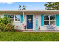 Charming home entrance featuring a patriotic wreath and colorful accents at 3015 Florida Blvd, Bradenton, FL 34207