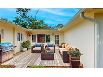 This outdoor patio boasts a grill, plenty of seating, and planters adding to the outdoor charm at 4300 16Th N Ave, St Petersburg, FL 33713
