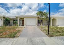 Charming single-story home with a well-maintained lawn and a two-car garage, located in a friendly neighborhood at 5427 Orange Blossom N Rd, Pinellas Park, FL 33782