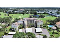Beautiful aerial view of the condo complex, golf course, lake and the surrounding landscape at 700 Starkey Rd # 311, Largo, FL 33771