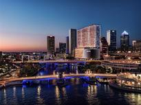 Stunning cityscape view at dusk with a river, illuminated bridges, and modern architecture creating a vibrant urban scene at 111 S Ashley Dr # 2601, Tampa, FL 33602