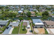 Charming waterfront home with lush landscaping, a private boat dock, and canal access at 4059 Orient Dr, Hernando Beach, FL 34607
